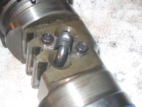 1991 Ford Bronco - A close-up view of a hydroboost component, a metal tube and securing bolts.
