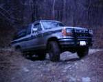 1990 Ford Ranger - A 1989 Ford Ranger pickup truck is seen from a three-quarter front angle on a dirt road.