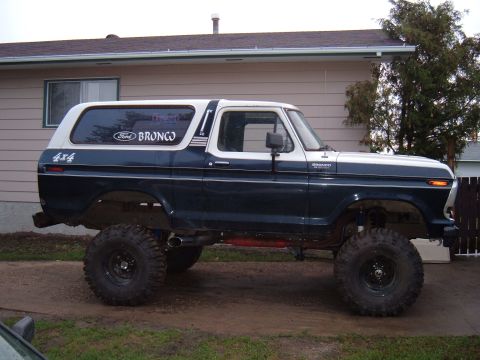 1979 Ford Bronco - This modified 1979 Ford Bronco features a lifted suspension and oversized tires, giving it an aggressive stance.