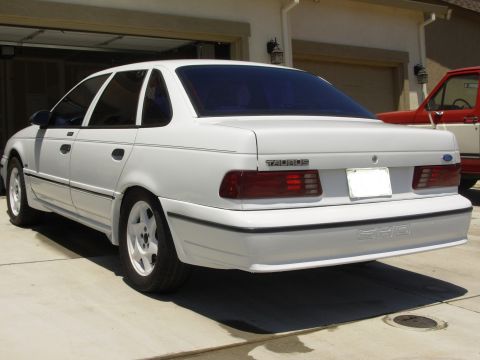 1995 Ford Taurus - Rear view of a white 1995 Ford Taurus SHO parked in a driveway.