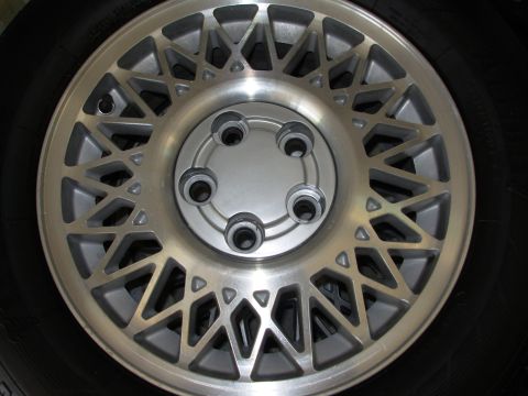 1995 Ford Taurus - Close-up of a single vehicle wheel, not a complete car.