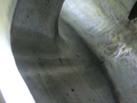 1996 Ford Crown Victoria - This is a close-up view of an engine intake manifold, showing its internal structure and surface texture.