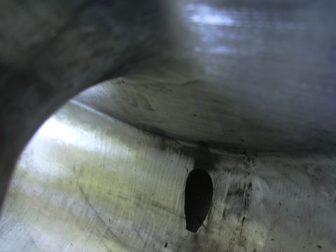 1996 Ford Crown Victoria - Close-up view of an engine intake plenum, revealing its internal structure and a notable opening.