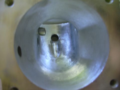 1996 Ford Crown Victoria - Close-up view inside a metal intake manifold, showing its internal structure and passages.