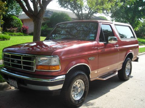 1995 Ford Bronco - This 1995 Ford Bronco is shown in a three-quarter front view, parked on a residential street.