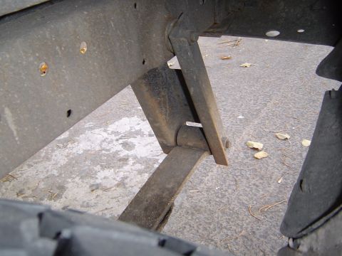 1996 Ford Explorer - Close-up view of a vehicle's leaf spring suspension system.