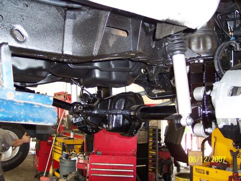 1996 Ford Bronco - Close-up of the undercarriage of a 1996 Ford Bronco, highlighting the rear axle and suspension.