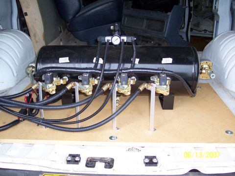 1996 Ford Bronco - Custom air suspension system installed in the cargo area of a van.