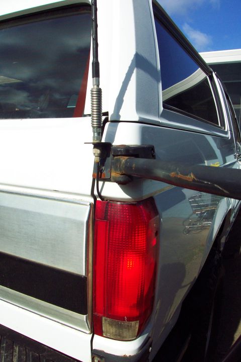 1996 Ford Bronco - CB Radio Antenna Mount Mounted to Tire Carrier Bracket (can't depend on the swing arm pin for good ground) Swing arm in un-latched position…