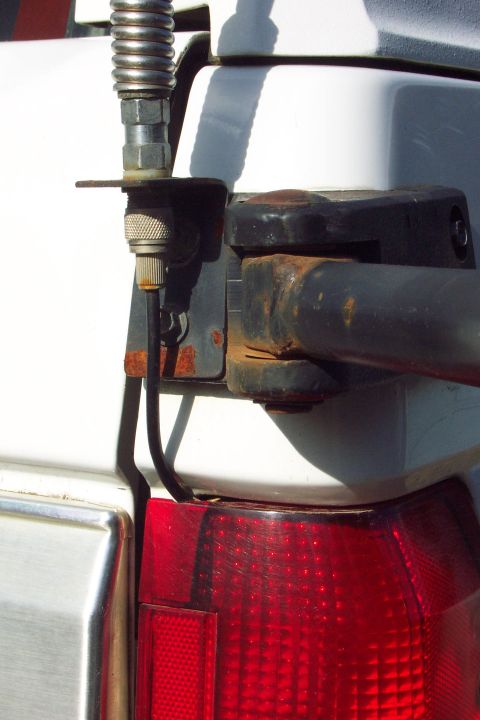 1996 Ford Bronco - CB Radio Antenna Mount Mounted to Tire Carrier Bracket (can't depend on the swing arm pin for good ground) Swing arm in un-latched position…