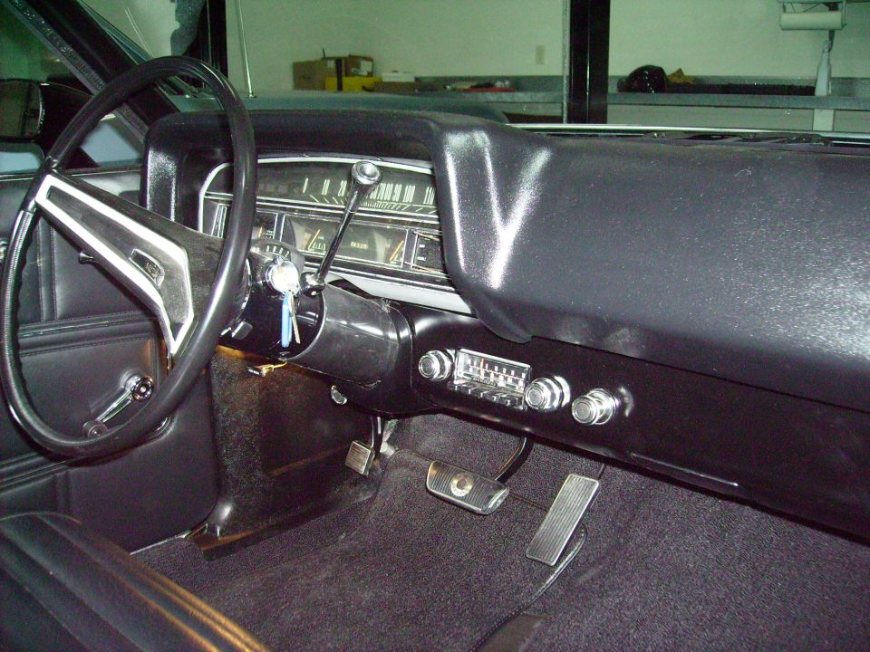 1970 Ford Ranchero interior with black dashboard, steering wheel, and radio