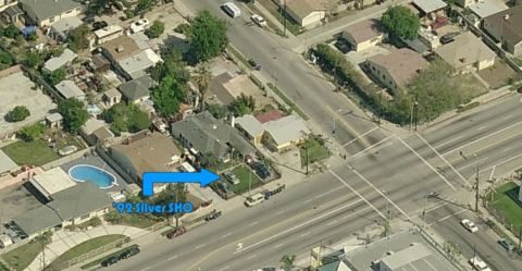 1993 Ford Taurus - Aerial view of a residential area, with an arrow pointing to a property labeled '92 Silver SHO'.