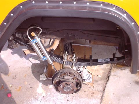 1977 Ford Bronco - Close-up of the rear suspension and shock absorber assembly on a 1977 Ford Bronco.