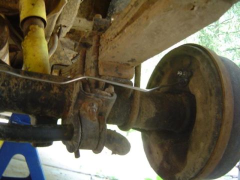 1979 Ford Bronco - Close-up view of the undercarriage, showing the rear axle and suspension system.