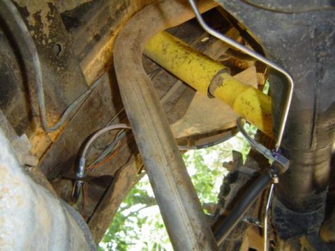 1979 Ford Bronco - Undercarriage view with exhaust and suspension components. Supermotors.net logo is present.