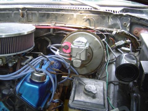 1979 Ford Bronco - The engine bay shows blue valve covers and a large air filter, but no clear year identification is visible.