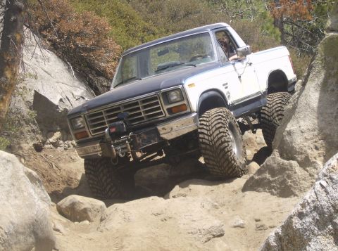 1986 Ford Bronco - This 1980s Ford Bronco is shown tackling a challenging rocky trail.