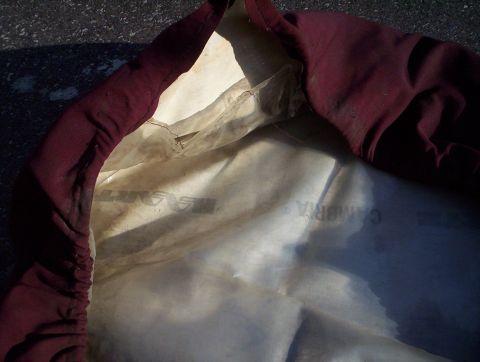 1991 Ford Bronco - A maroon car cover interior shows text and a watermark, indicating it is a part, not a vehicle.