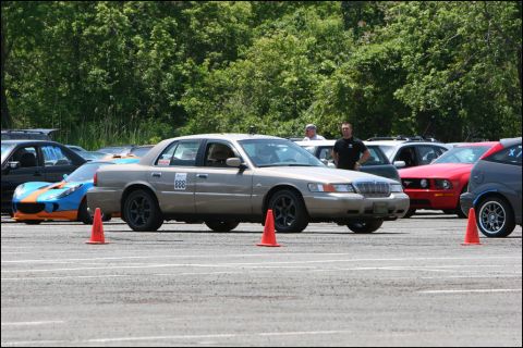 2001 Mercury Grand Marquis - A 2001 Mercury Grand Marquis is seen at an autocross event, identified by its racing number and cones on the track.