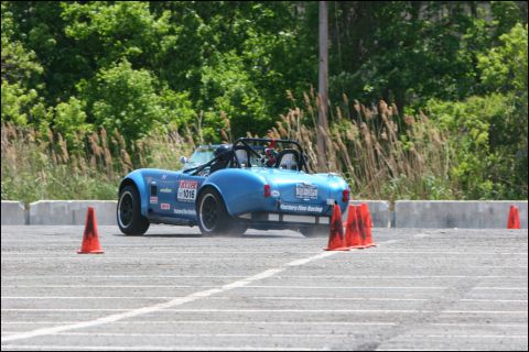 2001 Mercury Grand Marquis - Race car with number 1016 on the door maneuvers through a cone course.