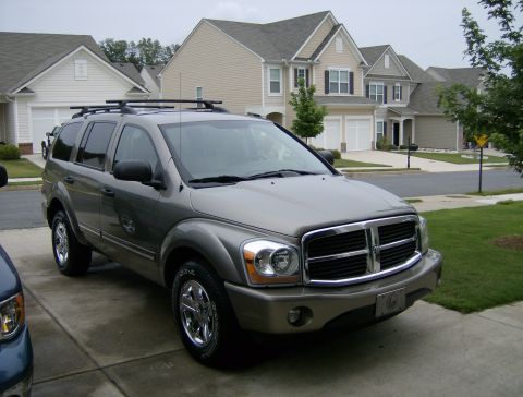 2004 Dodge Durango - A gray 2004 Dodge Durango SUV is parked in a suburban driveway.