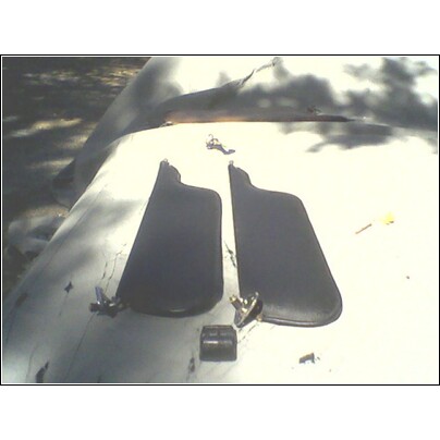 1973 Ford Ranchero - Pair of sun visors removed from a vehicle, likely for replacement or restoration.