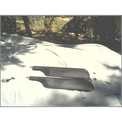 1973 Ford Ranchero - A pair of sun visors are displayed on a white tarp outdoors, with trees in the background.