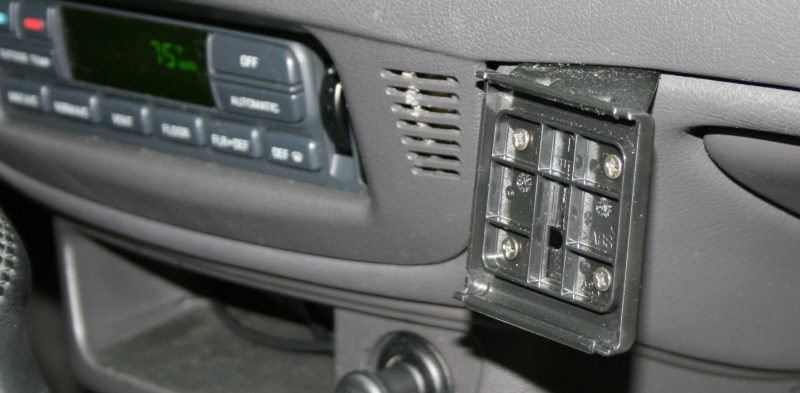 2002 Ford Crown Victoria interior dashboard with radio and open compartment