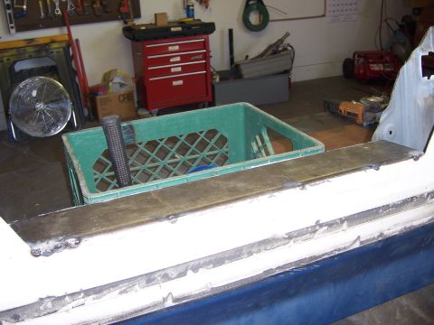 1991 Ford Bronco - Welded vehicle body panel in a garage setting with a green crate and tools visible.