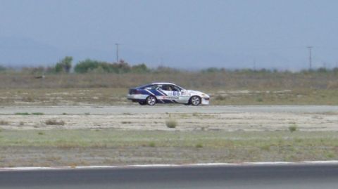 1990 Ford Probe - A 1990 Ford Probe race car, marked with number 86, is seen on the track.