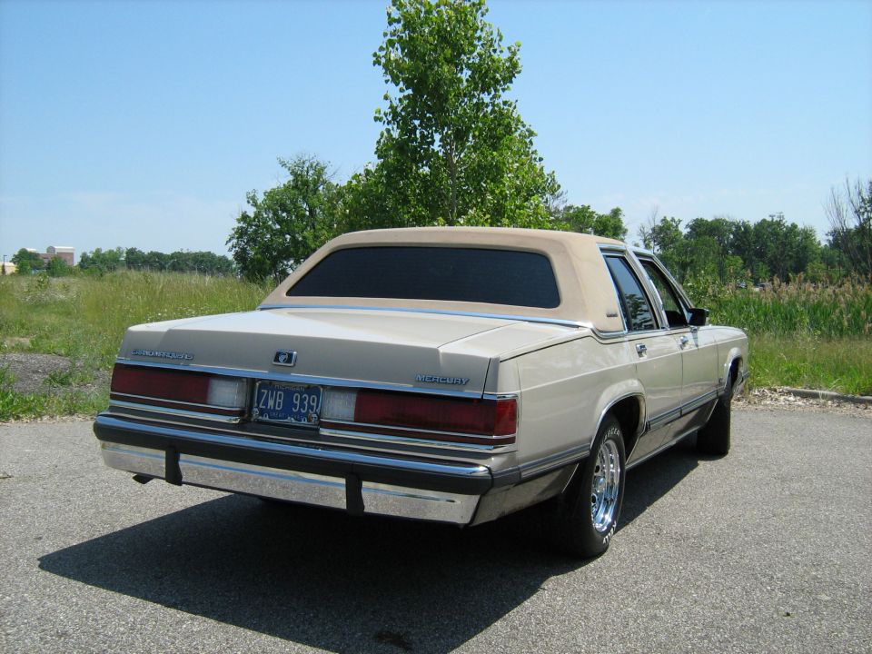 Rear three-quarter of a tan Mercury sedan with vinyl top