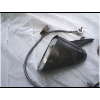 1973 Ford Ranchero - Side mirror assembly with attached wiring, shown on a white fabric surface.
