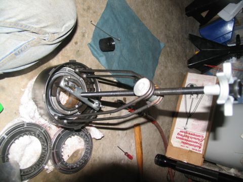 1978 Ford Bronco - A specialized tool is being used to compress clutch springs within an automatic transmission component.