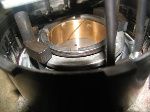1978 Ford Bronco - Internal view of a transmission part, highlighting a brass bushing and mechanical components.