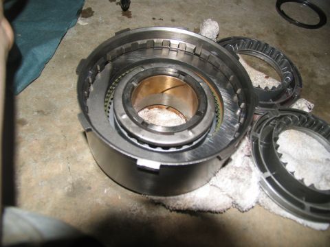 1978 Ford Bronco - Transmission clutch pack and drum components laid out on a rag for inspection or repair.