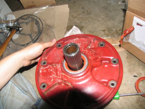 1978 Ford Bronco - Close-up of a red transmission component, likely part of a rebuild process.