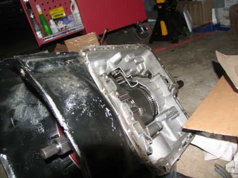 1978 Ford Bronco - The internal components of an automatic transmission are visible after disassembly.