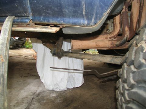 1978 Ford Bronco - Underside view of a blue vehicle, showing suspension and exhaust system details.