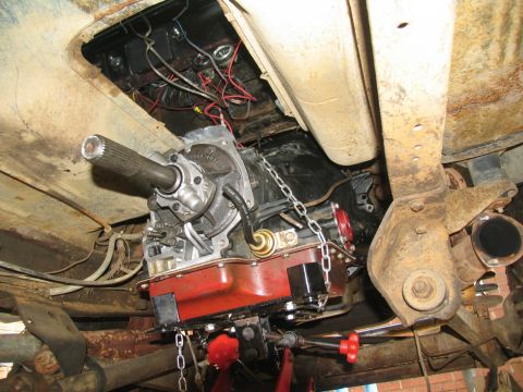 1978 Ford Bronco - Underbody view of a vehicle's transmission and driveshaft during service.