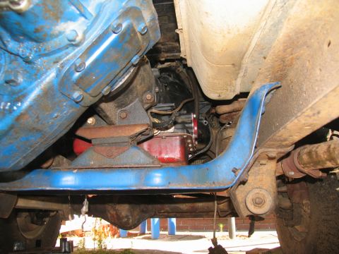 1978 Ford Bronco - Close-up view of the undercarriage, focusing on the transmission and suspension components.