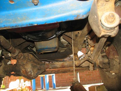 1978 Ford Bronco - Undercarriage of a 1978 Ford Bronco, focusing on the transmission and rear differential assembly.