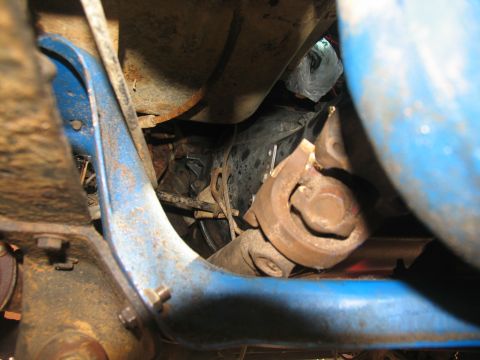 1978 Ford Bronco - Underside view of a vehicle's driveshaft and U-joint, showing mechanical components.
