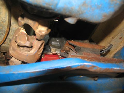 1978 Ford Bronco - Close-up view of a driveshaft u-joint and a worn transmission mount.