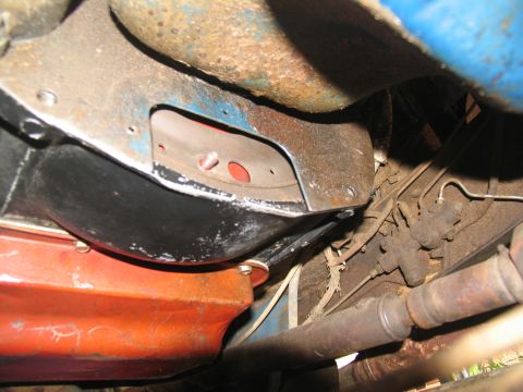1978 Ford Bronco - Close-up of the vehicle's undercarriage, focusing on mechanical parts like the transmission and driveshaft.