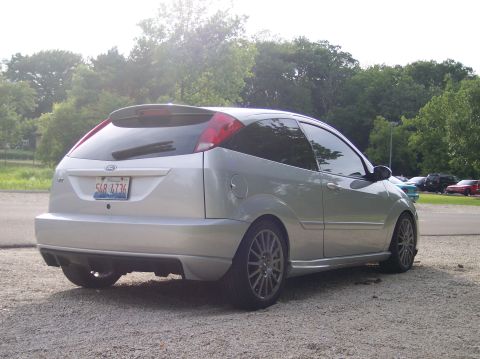 2003 Ford Focus - This silver 2003 Ford Focus hatchback is shown from the rear 3/4 angle, displaying its license plate.