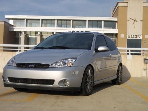 2003 Ford Focus - Silver 2005 Ford Focus hatchback parked in front of a building with a clock tower.