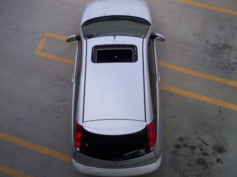 2003 Ford Focus - A silver 2003 Ford Focus is seen from a bird's-eye view in a parking lot.