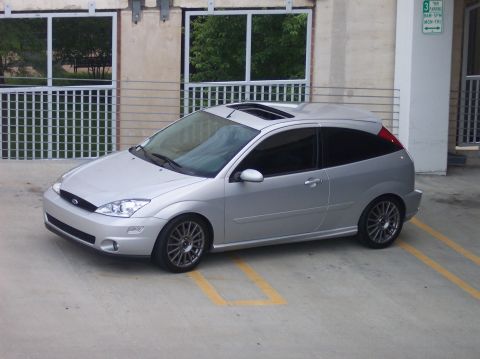 2003 Ford Focus - Silver 2003 Ford Focus hatchback parked in a lot with a sunroof.