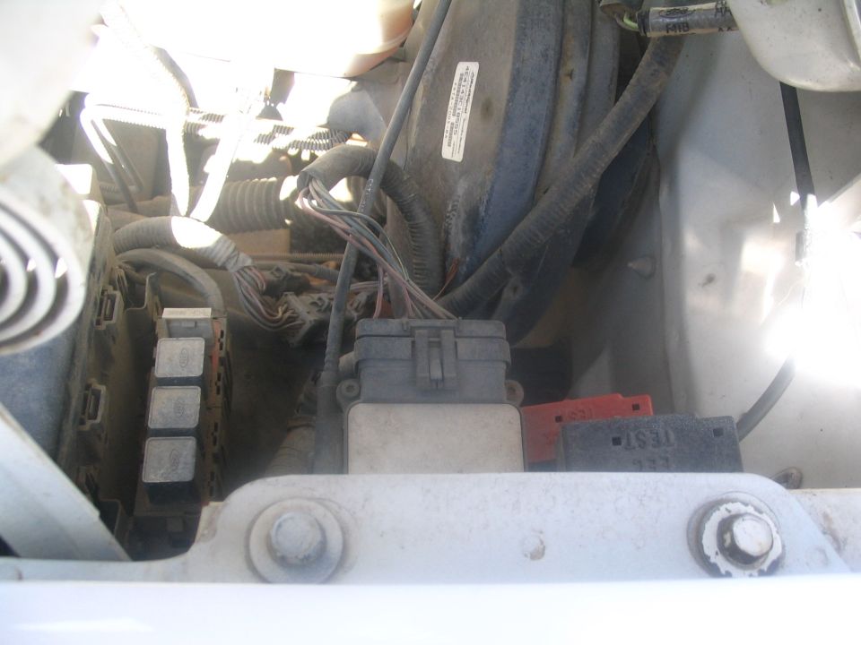 Engine bay with Ford relays, connectors and wiring harness