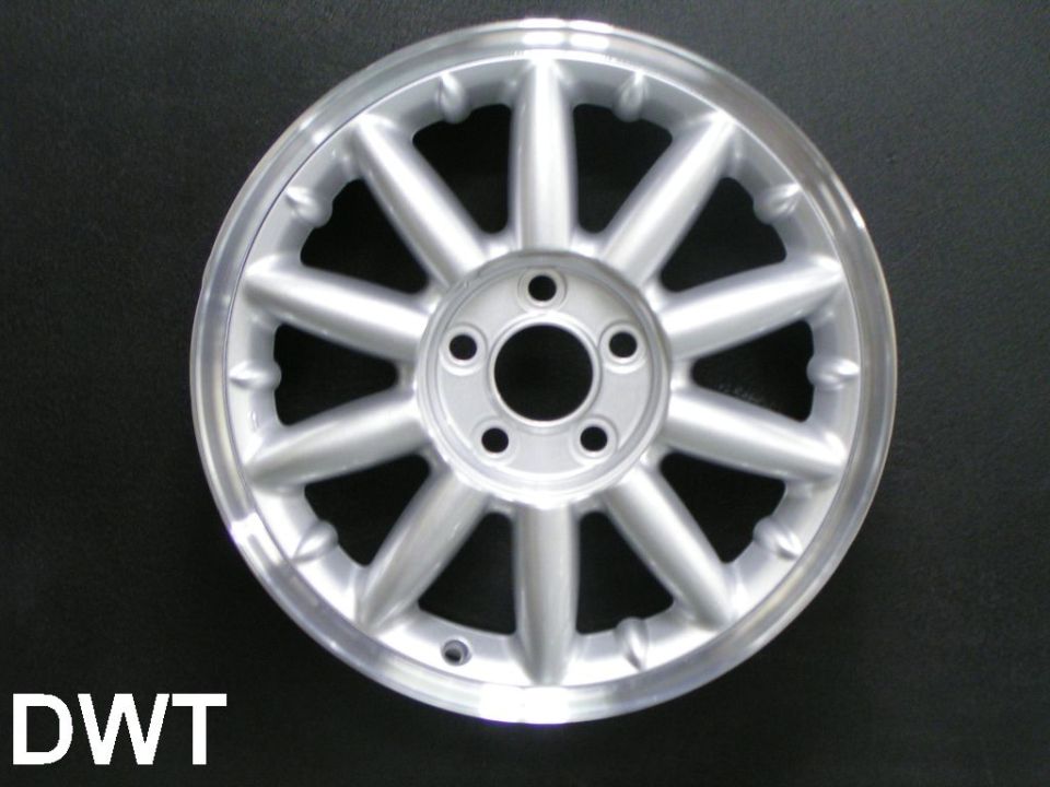 Silver alloy wheel with 10 spokes and a black background